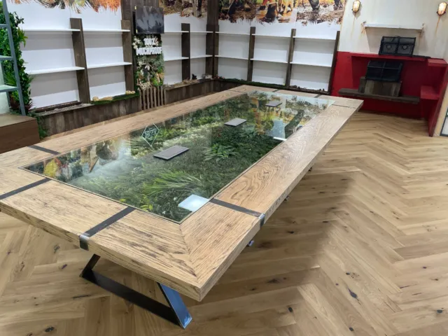 office-fit-out-coventry-greenery-table Office fit out in Coventry showcasing a creative table design with embedded greenery.