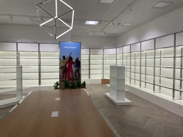 office-refurbishment-birmingham-retail-lighting Office refurbishment in Birmingham with a modern retail-style display and unique geometric lighting.